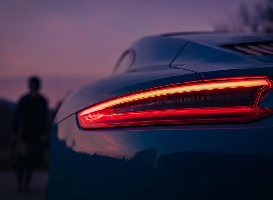 Tail lamp of a car in a sunset scenery